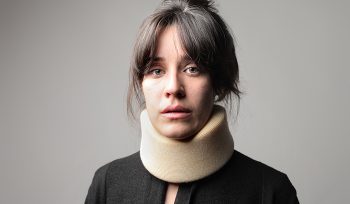 Woman in neck brace