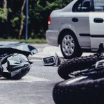 Motorcycle Helmet On The Street After Terrible Car Crash